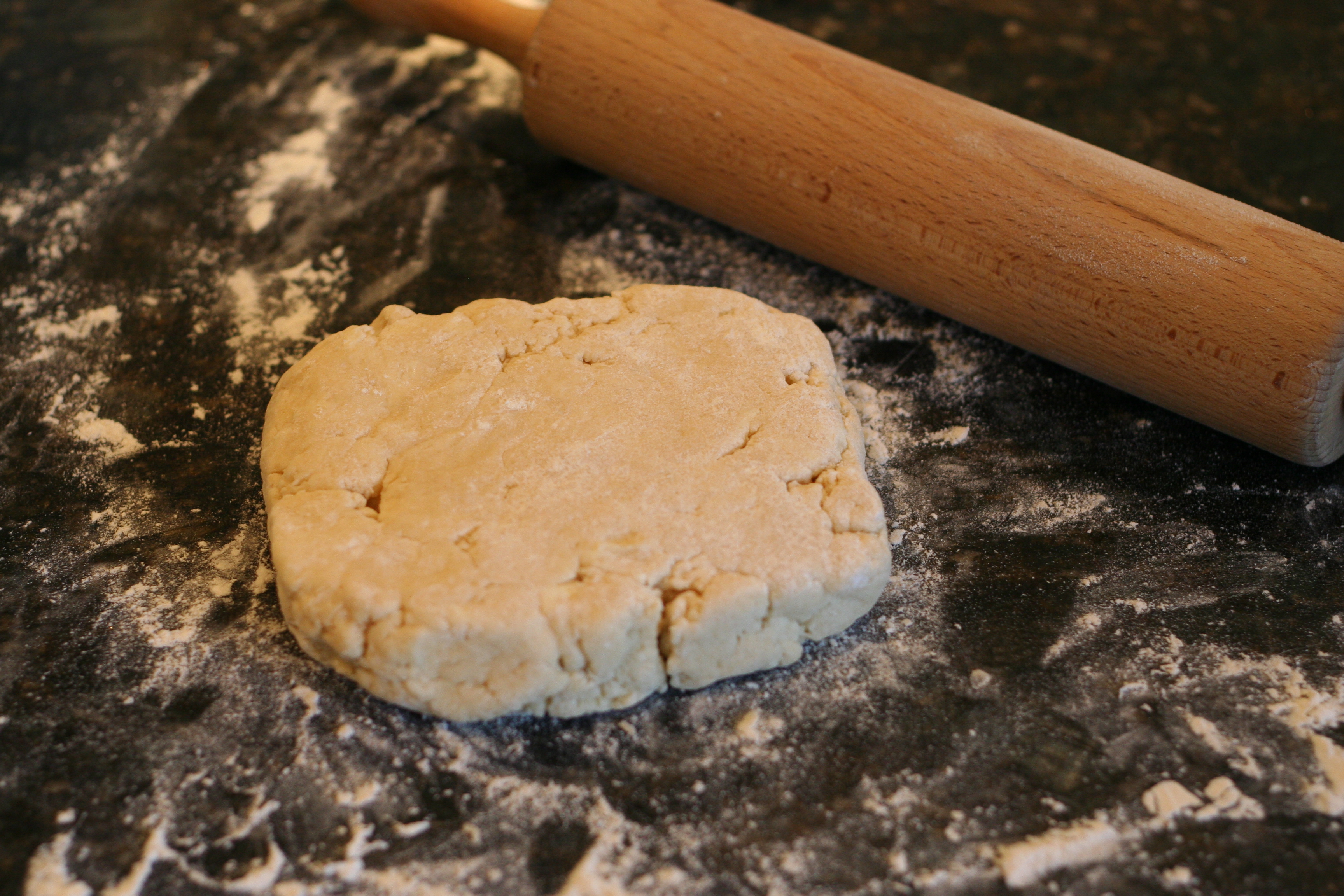Gently pat the dough into a square.
