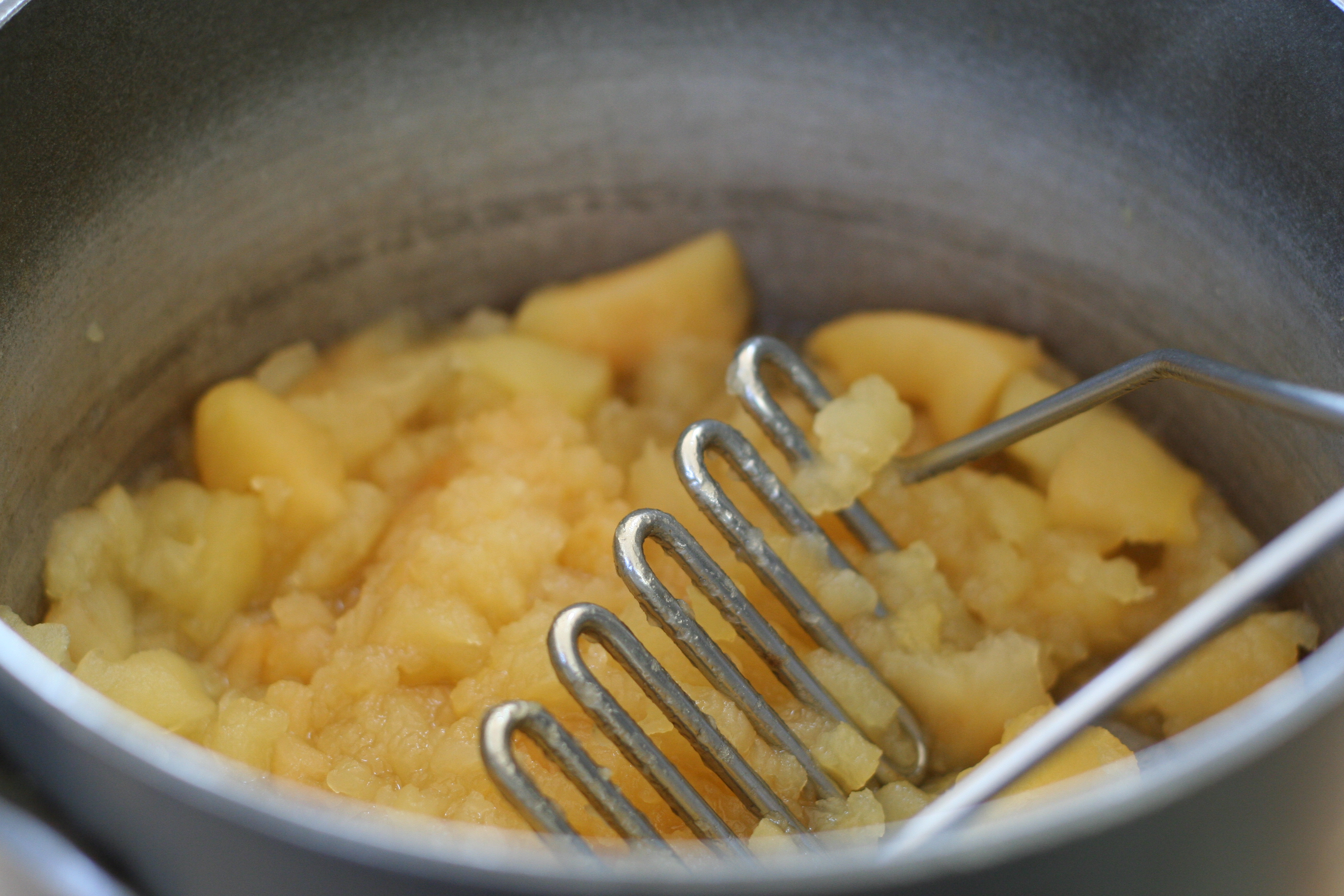 Mashing Cooked Apples for Applesauce